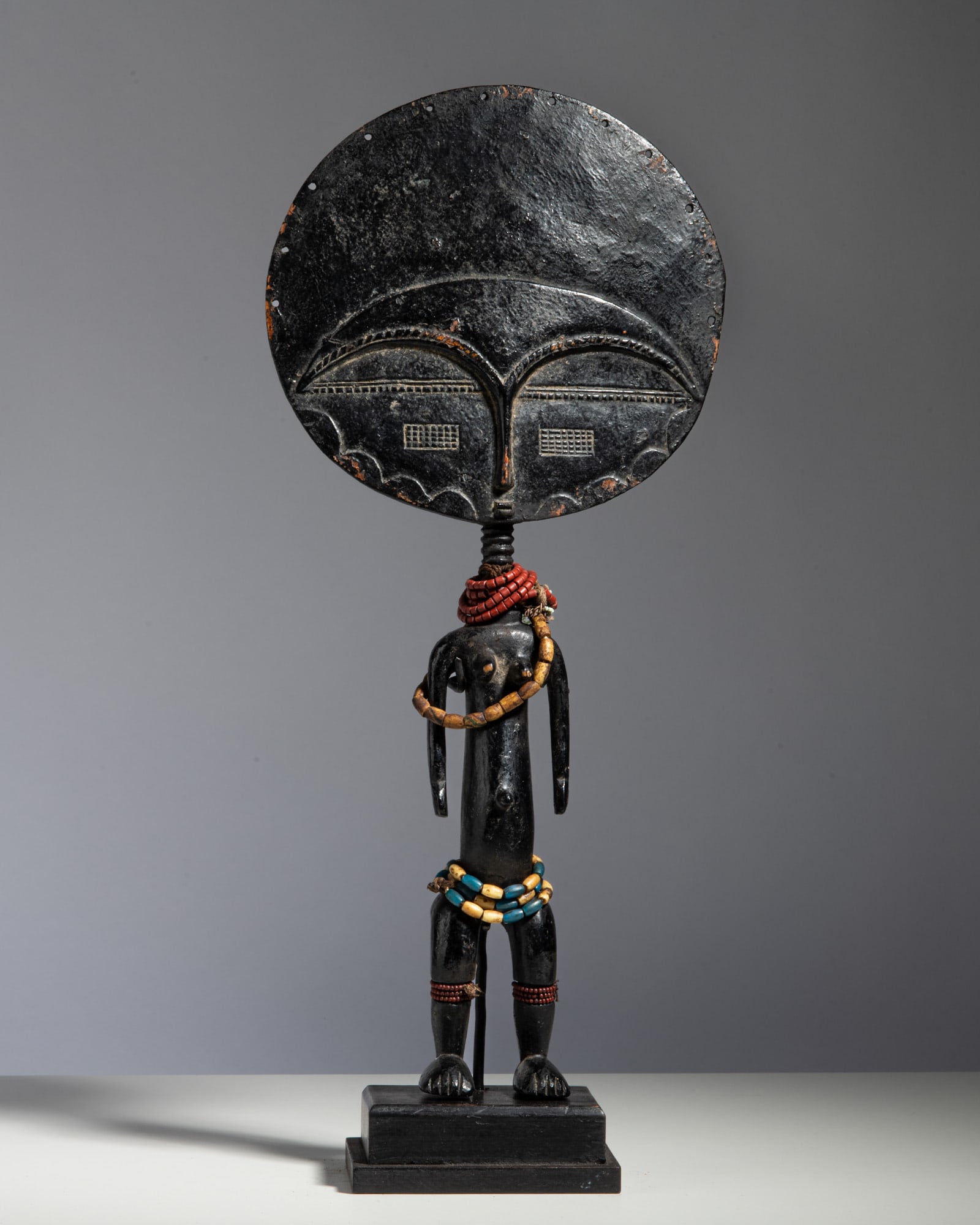 AN ASHANTI AKUA'BA FERTILITY DOLL Ghana Wood and colored beads This classic fertility figure (1 of 2)