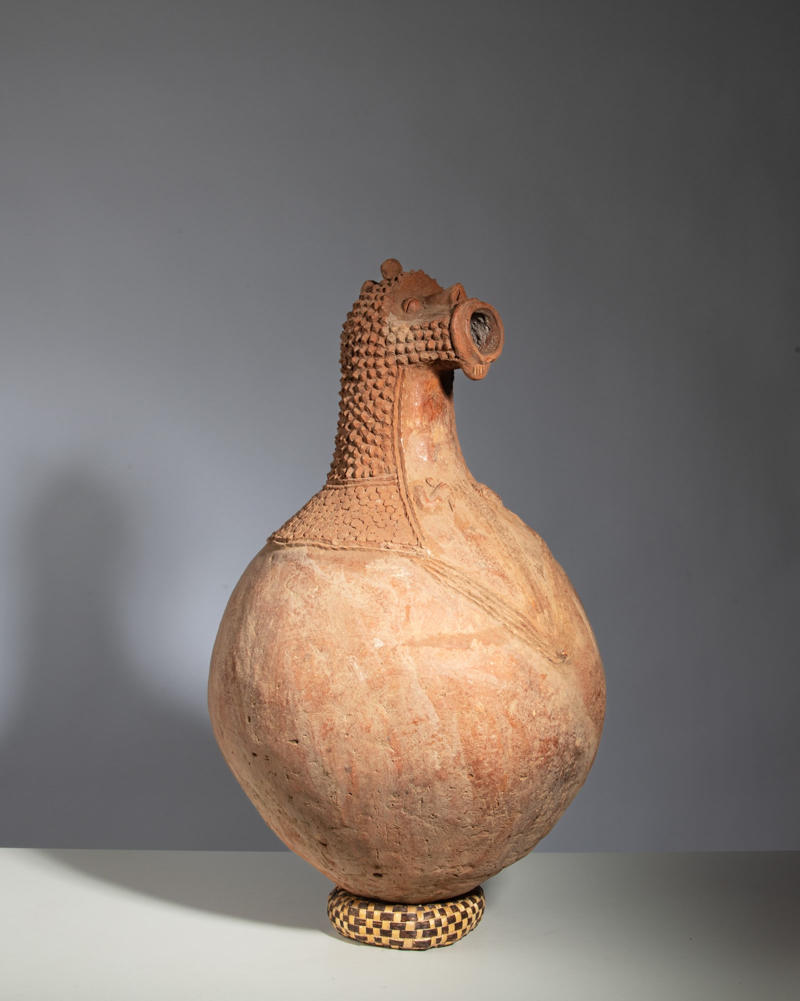 A RARE MAMBILA CERAMIC VESSEL Mambila People / Nigeria Terracotta This striking ceramic vessel, (1 of 4)