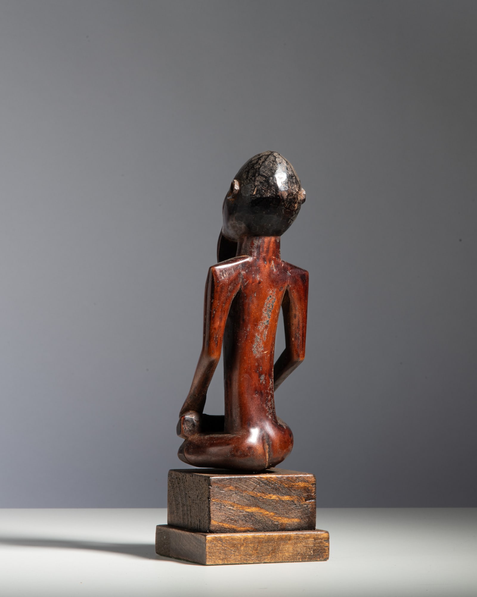 A BEMBE SEATED FIGURE Democratic Republic of the Congo Wood and pigment This expressive power (1 of 1)