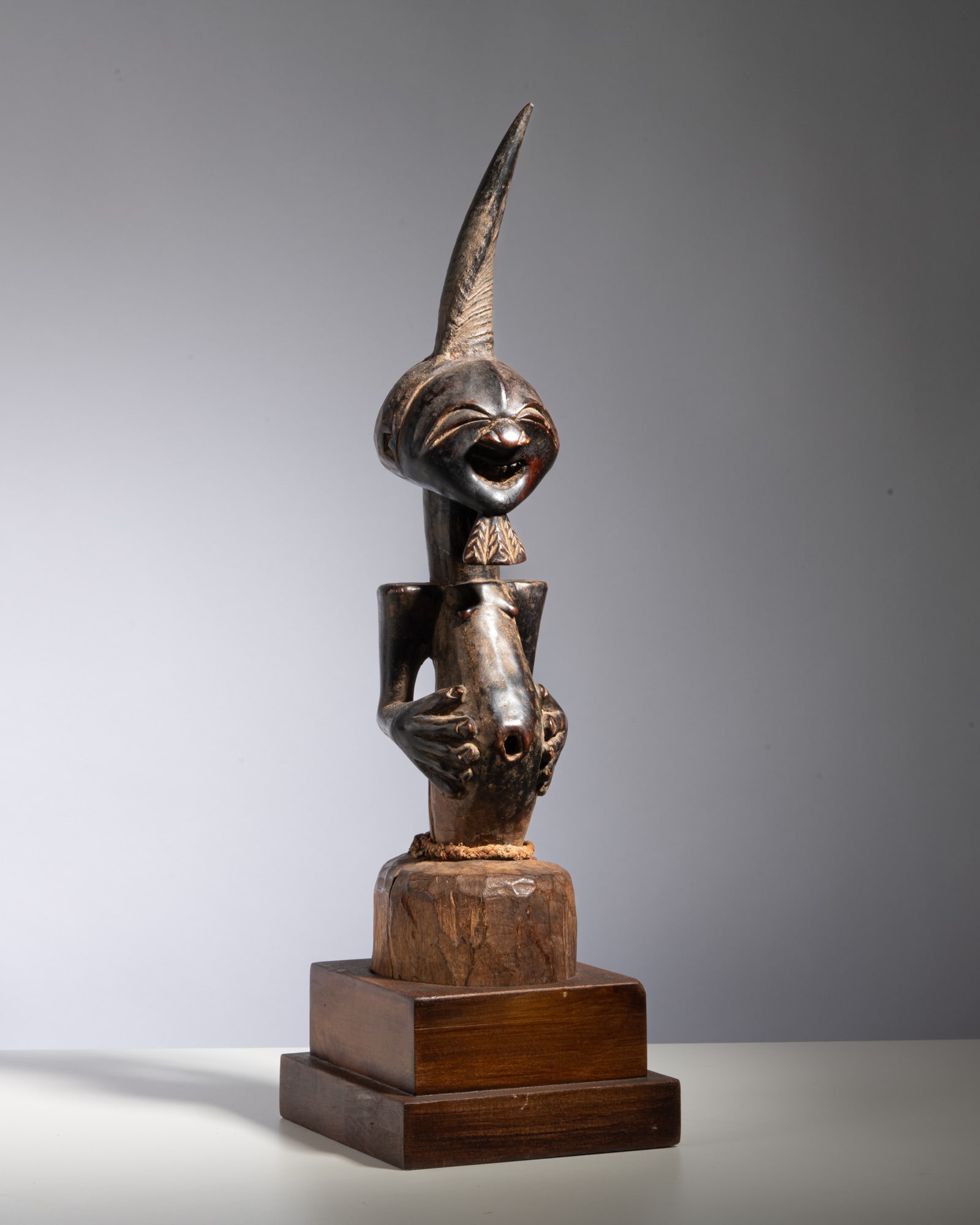 A LARGE SONGYE COMMUNITY POWER FIGURE Democratic Republic of the Congo Wood, horn, hide, and (1 of 3)