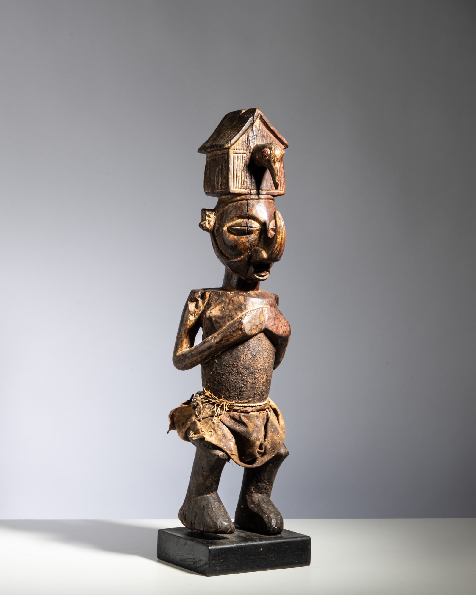 A YAKA CEREMONIAL POWER FIGURE WITH A HEADDRESS STRUCTURE Democratic Republic of the Congo Wood, (1 of 5)