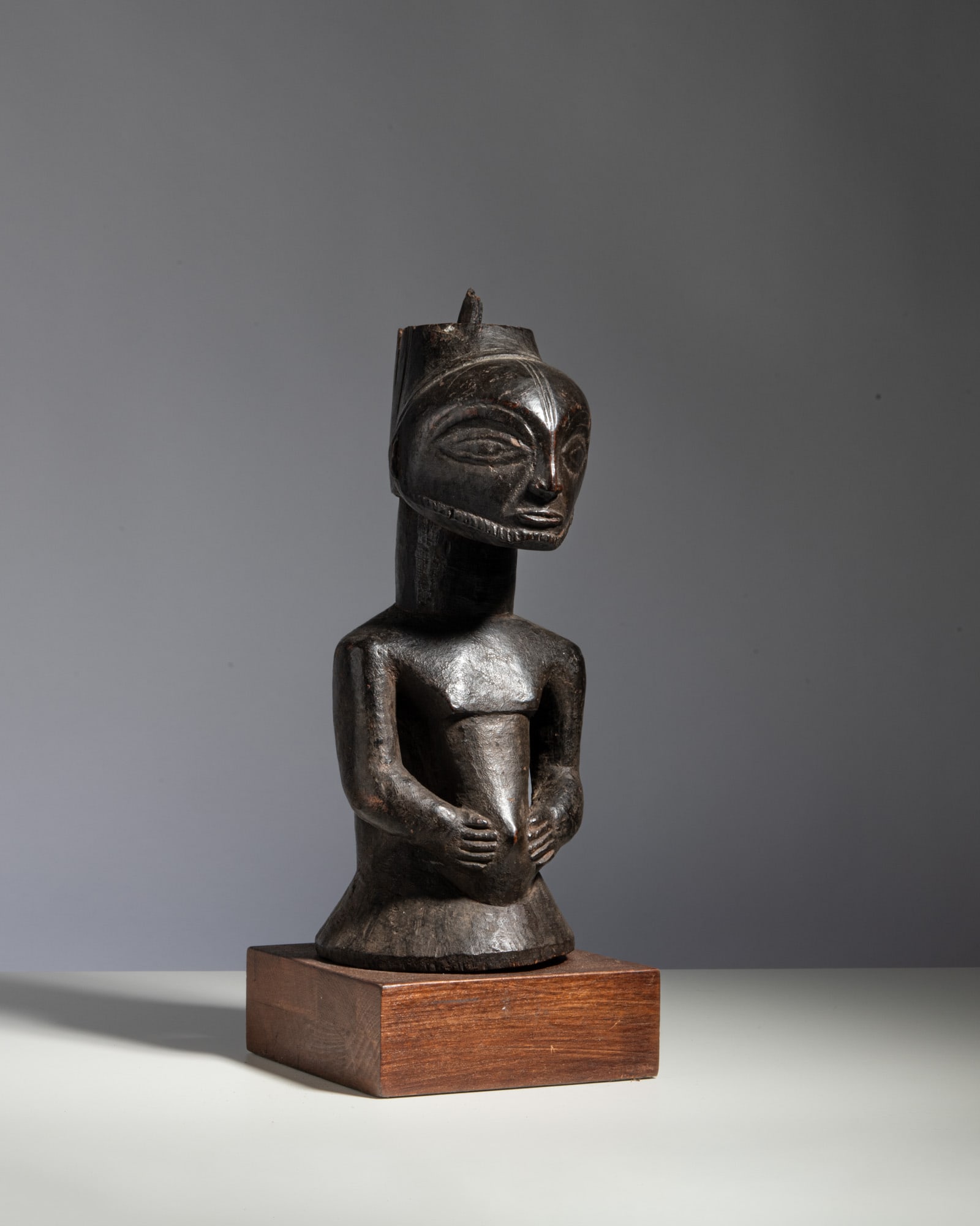 A KUSU POWER FIGURE Democratic Republic of the Congo Wood This commanding ancestral power figure (1 of 3)