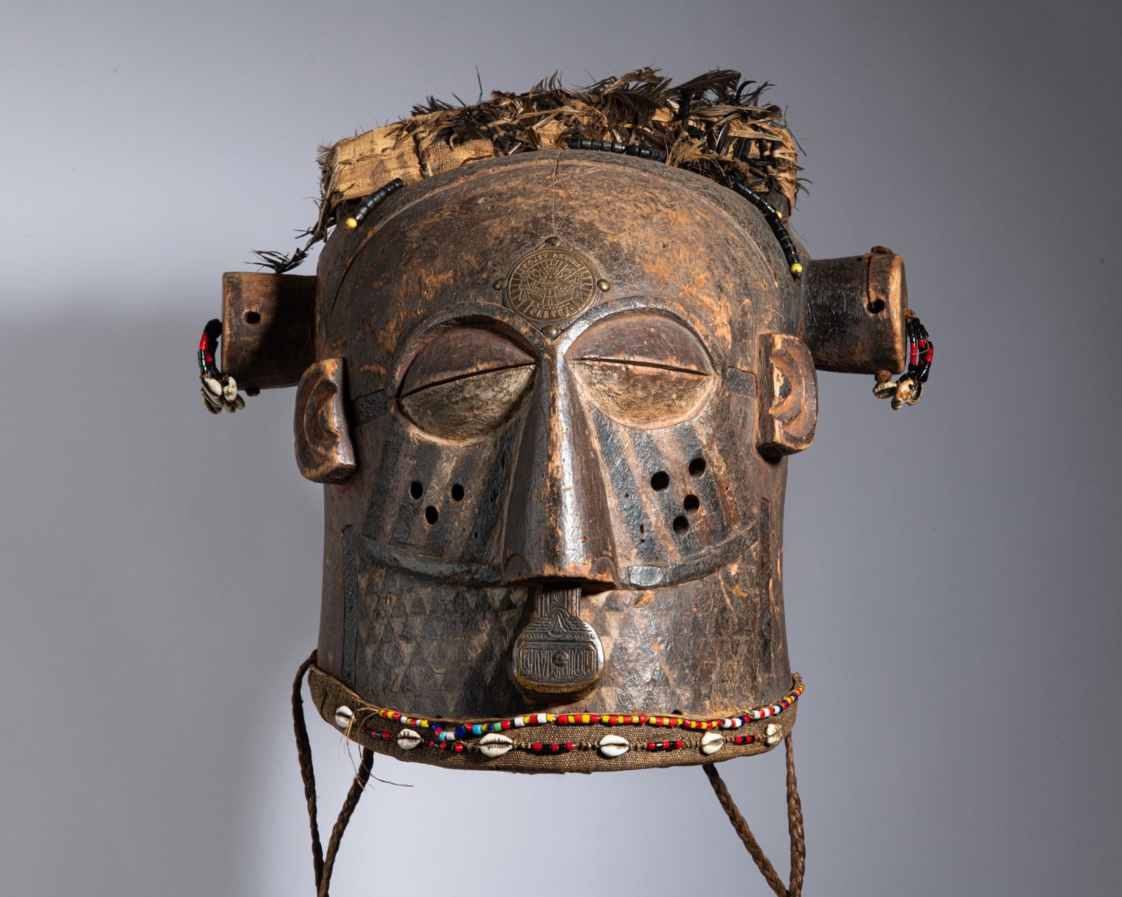 A MAGNIFICENT KUBA MWAASH AMWOOY HELMET MASK Democratic Republic of the Congo Wood, textile, (1 of 4)