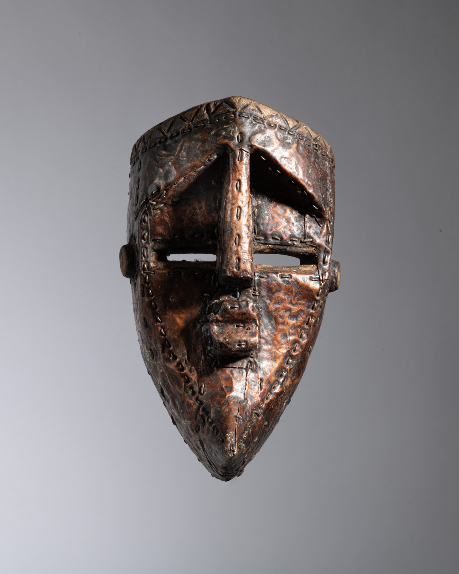 A STRIKING AND GEOMETRIC LWALWA CEREMONIAL MASK Democratic Republic of the Congo Wood and copper (1 of 5)
