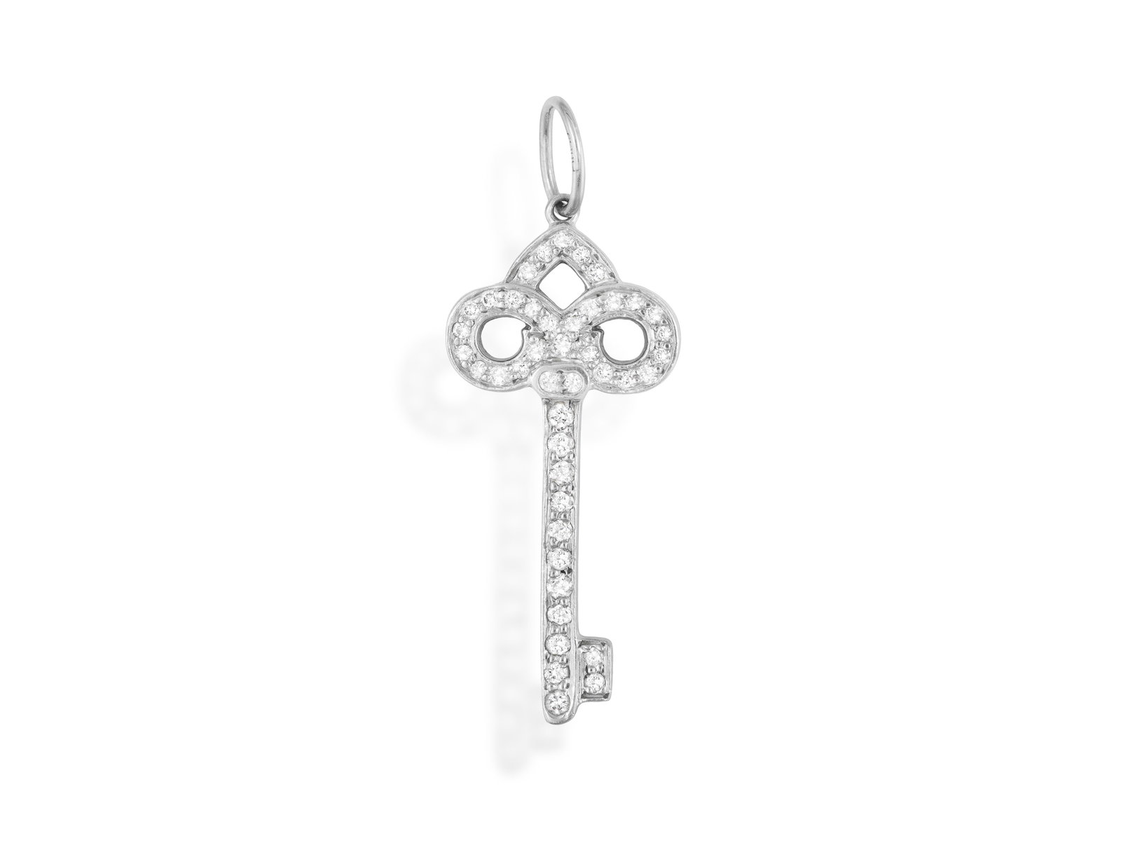 TIFFANY & CO.: A DIAMOND ‘FLEUR DE LIS KEY’ PENDANT Designed as a key with swirl: TIFFANY & CO.: A DIAMOND ‘FLEUR DE LIS KEY’ PENDANT Designed as a key with swirl detailing, pavé-set with brilliant-cut diamonds, mounted in platinum, signed Tiffany & Co., accompanie