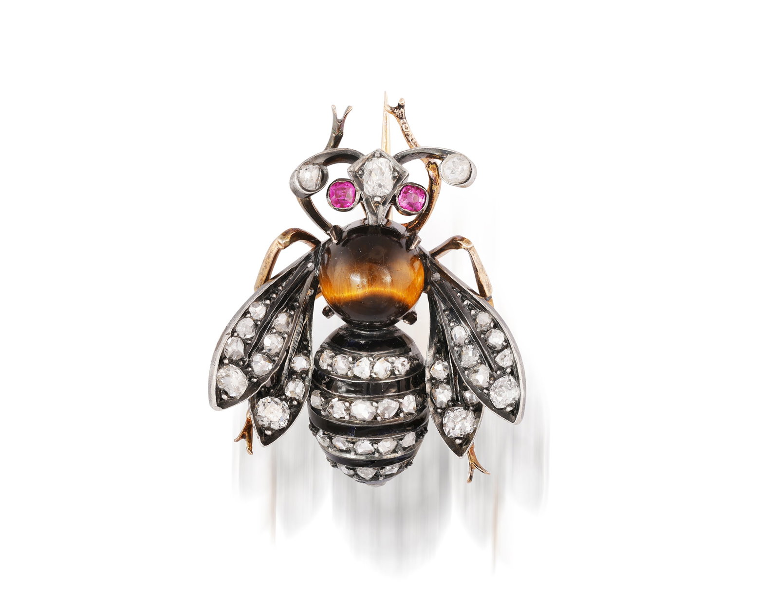 A LATE VICTORIAN GEM-SET AND ENAMEL NOVELTY BROOCH, CIRCA 1880 Realistically modelled as a bee, the: A LATE VICTORIAN GEM-SET AND ENAMEL NOVELTY BROOCH, CIRCA 1880 Realistically modelled as a bee, the cabochon tiger's eye thorax to a black enamel and rose-cut diamond striped abdomen, the wings pav