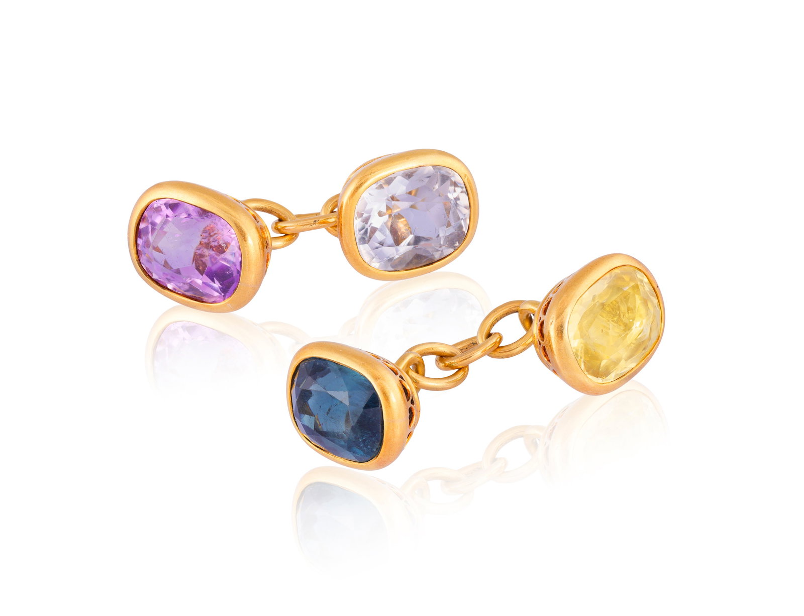 A PAIR OF LATE 19TH CENTURY GEM-SET CUFFLINKS Each terminal collet-set with either an oval-shaped (1 of 2)