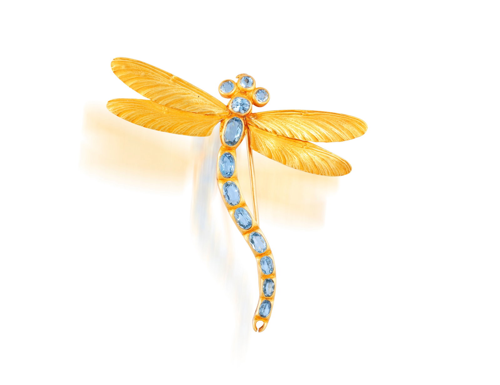 ARNOULD: AN ART NOUVEAU AQUAMARINE BROOCH Modelled as a dragonfly, the body set with oval and: ARNOULD: AN ART NOUVEAU AQUAMARINE BROOCH Modelled as a dragonfly, the body set with oval and circular-cut aquamarines, to textured gold wings, mounted in 18K gold, signed Arnould, French assay marks,