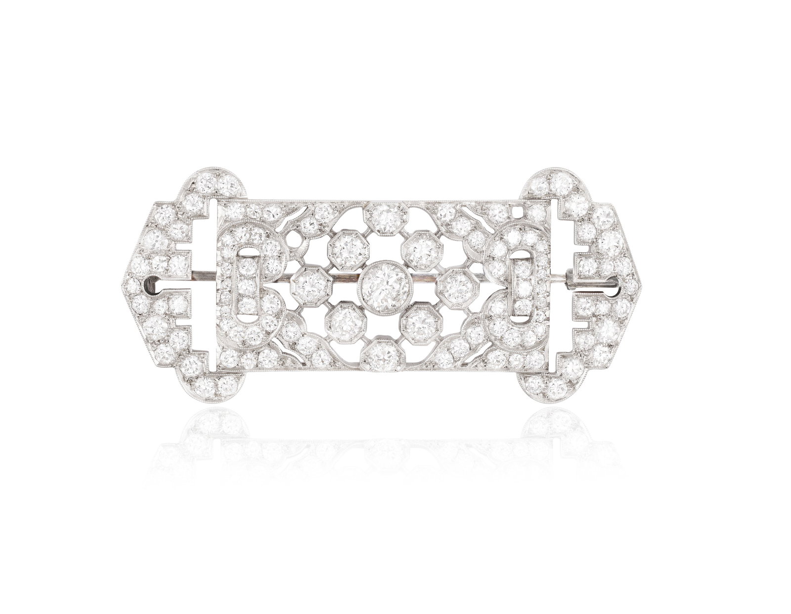 AN ART DECO DIAMOND BROOCH, CIRCA 1925 The openwork geometric plaque, set throughout with (1 of 3)