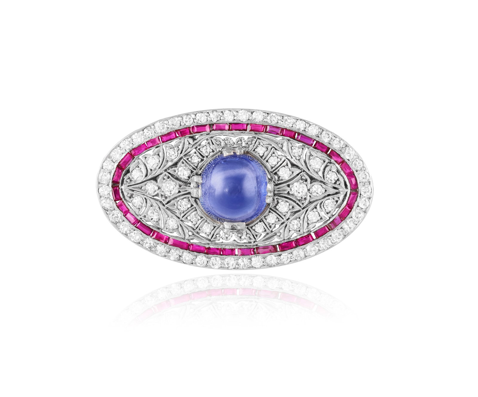 A SAPPHIRE, RUBY AND DIAMOND BROOCH The circular sugarloaf sapphire cabochon weighing approximately: A SAPPHIRE, RUBY AND DIAMOND BROOCH The circular sugarloaf sapphire cabochon weighing approximately 4.10cts, to a pierced mount set with single-cut diamonds and calibré-cut ruby frame, within scr