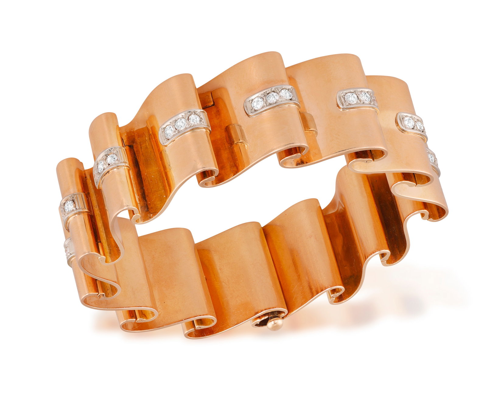 A RETRO DIAMOND BRACELET, CIRCA 1945 Designed as a series of scrolled, wave-form links in polished: A RETRO DIAMOND BRACELET, CIRCA 1945 Designed as a series of scrolled, wave-form links in polished gold, each highlighted with a line of circular-cut diamonds, mounted in 18K gold, length 18.1cm