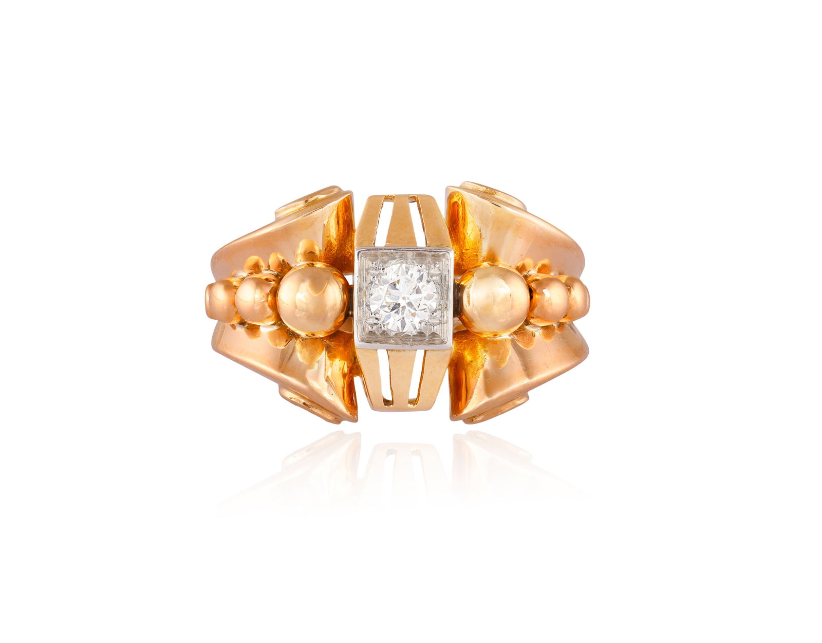 A RETRO DIAMOND RING Of retro design, the shoulders of stylised scrolling form applied with (1 of 5)