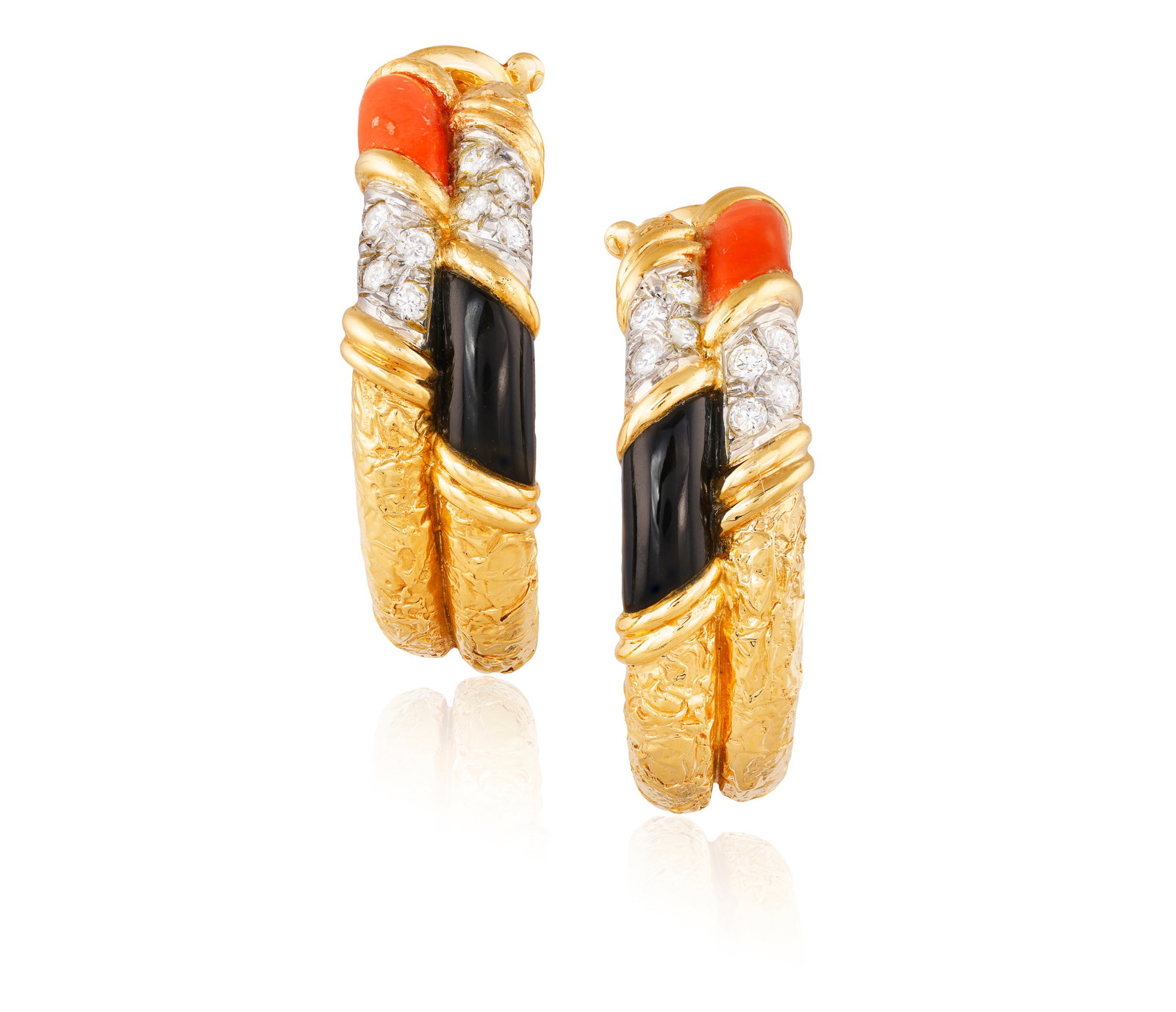 VAN CLEEF AND ARPELS: A PAIR OF CORAL, ONYX AND DIAMOND EARRINGS, CIRCA 1970 Each textured gold: VAN CLEEF AND ARPELS: A PAIR OF CORAL, ONYX AND DIAMOND EARRINGS, CIRCA 1970 Each textured gold hoop set at the front with brilliant-cut diamonds, coral and onyx, between reeded borders, mounted in 18