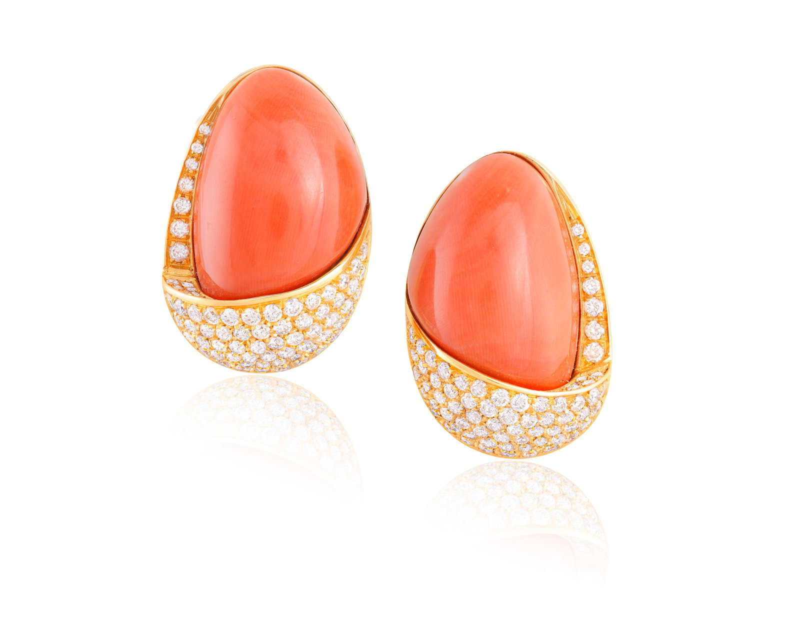 REPOSSI: A PAIR OF CORAL AND DIAMOND EARCLIPS, CIRCA 1975-1980 Each designed as a freeform coral: REPOSSI: A PAIR OF CORAL AND DIAMOND EARCLIPS, CIRCA 1975-1980 Each designed as a freeform coral cabochon within a bordered surround pavé-set with brilliant-cut diamonds, mounted in 18K gold, diamond