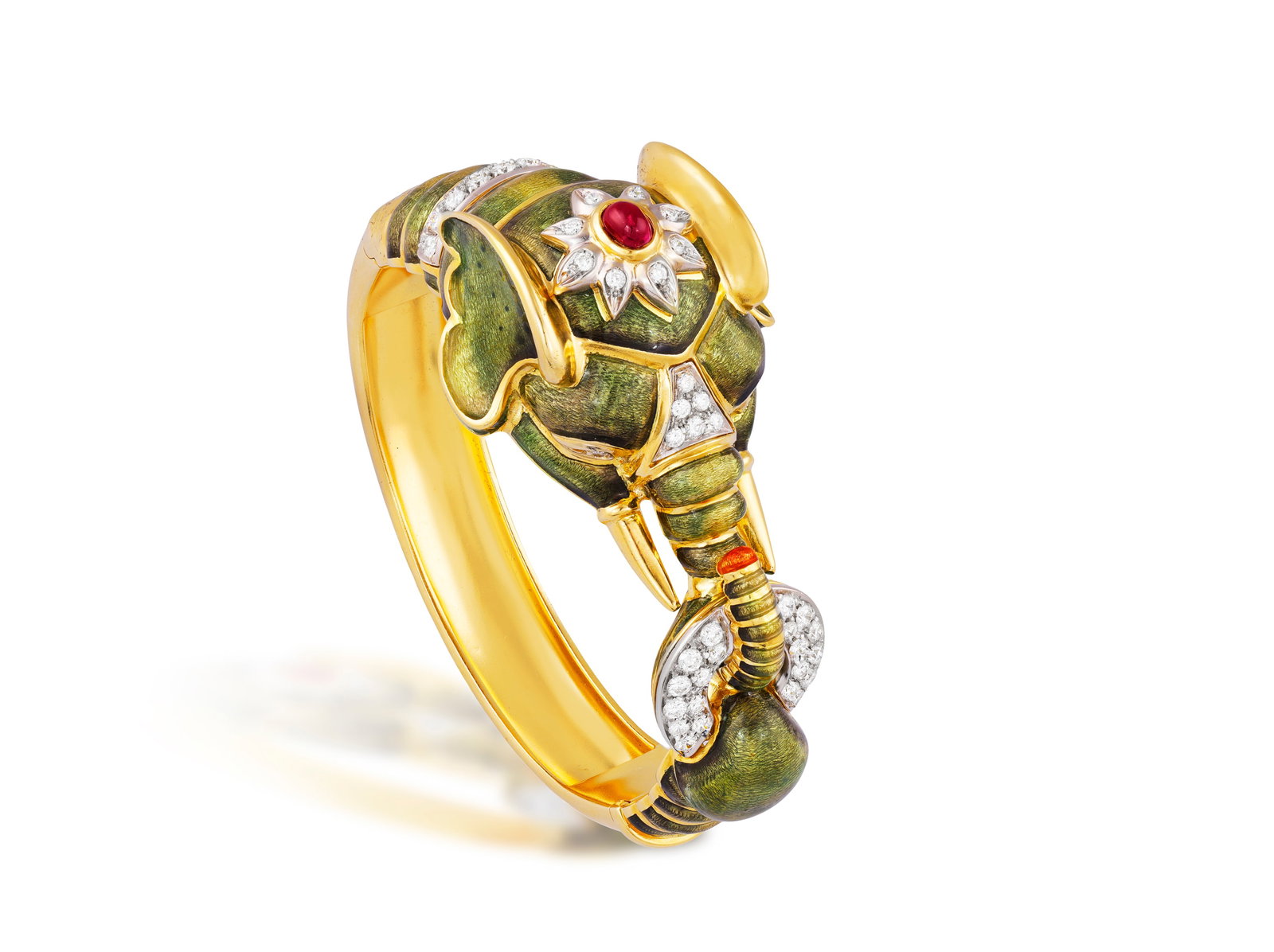 FRASCAROLO: A COLLECTABLE ENAMEL, RUBY AND DIAMOND BRACELET, CIRCA 1970 Designed as a stylised: FRASCAROLO: A COLLECTABLE ENAMEL, RUBY AND DIAMOND BRACELET, CIRCA 1970 Designed as a stylised elephant, the head and tail applied with shaded green enamel, the tusks and hinged bangle body in polishe