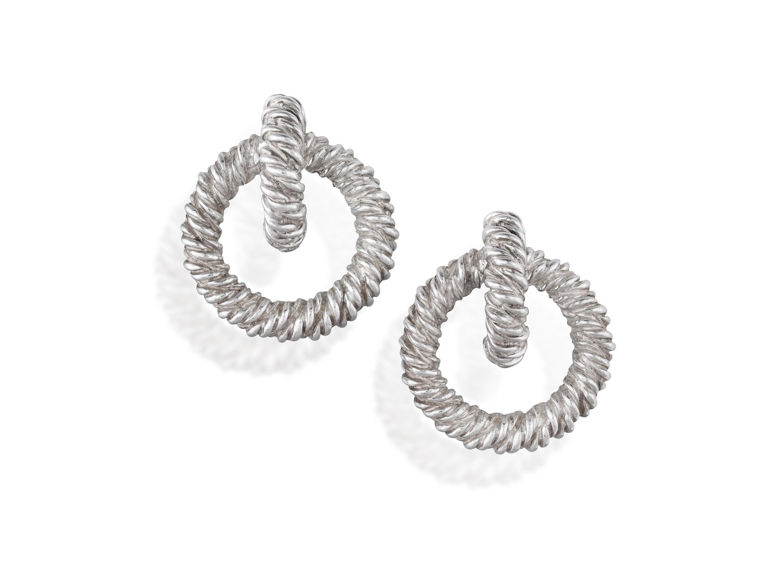 HERMÈS: A PAIR OF SILVER HOOP EARCLIPS Each designed as a ropetwist circular hoop suspended (1 of 3)