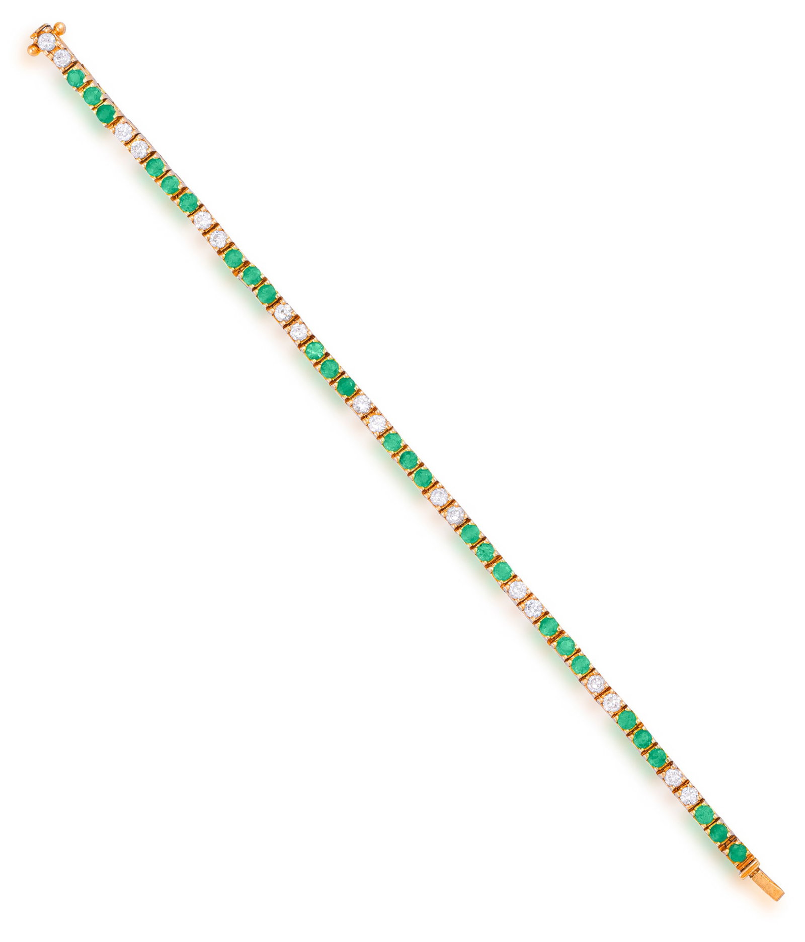 AN EMERALD AND DIAMOND LINE BRACELET Composed of a continuous line alternatively set with a series: AN EMERALD AND DIAMOND LINE BRACELET Composed of a continuous line alternatively set with a series of circular-cut emeralds and brilliant-cut diamonds, mounted in 14K gold, diamonds approximately 1.40