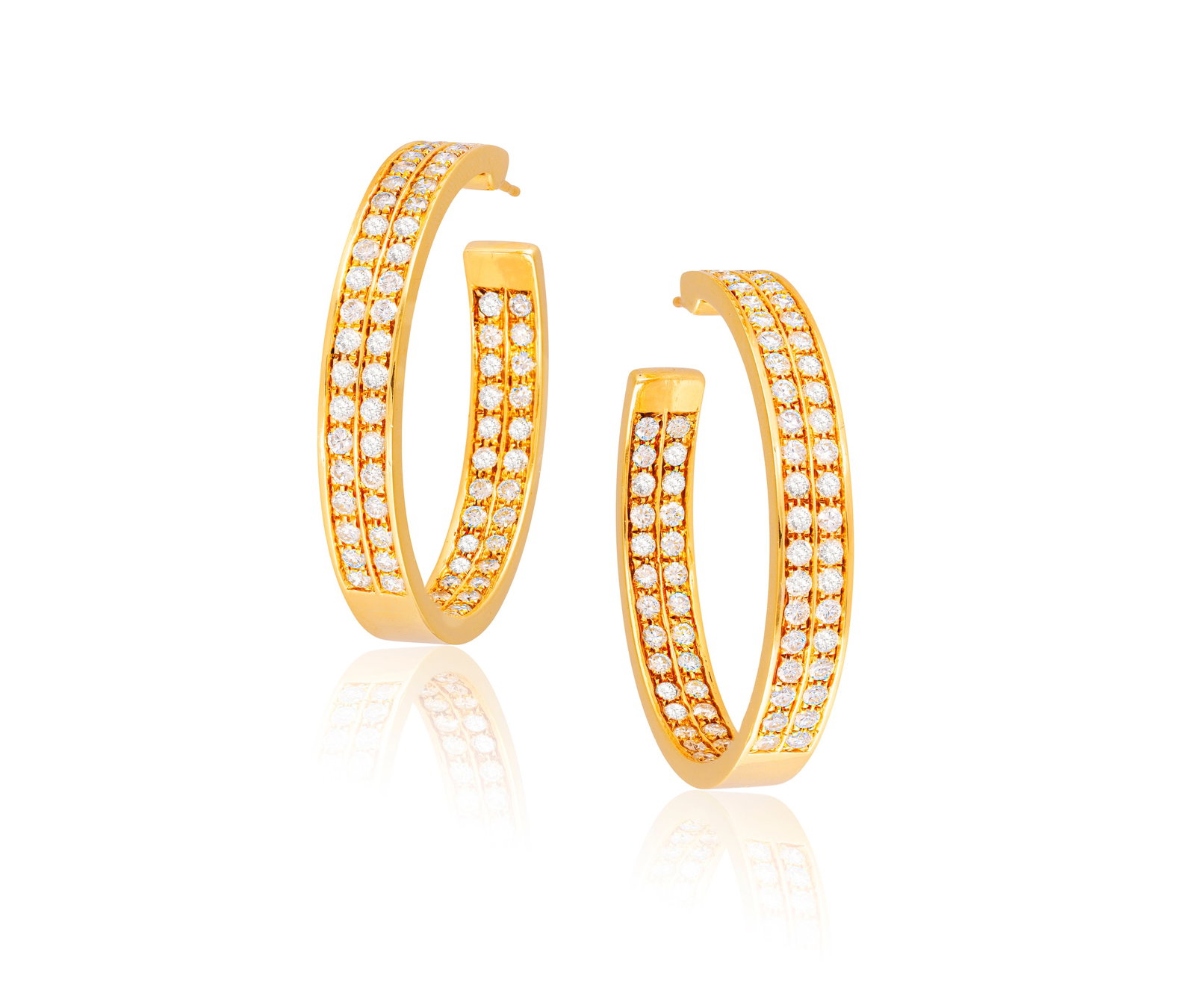 A PAIR OF DIAMOND HOOP EARRINGS Each composed of two brilliant-cut diamond rows to the front and: A PAIR OF DIAMOND HOOP EARRINGS Each composed of two brilliant-cut diamond rows to the front and interior, mounted in 18K gold, diamonds approximately 5.50cts total, length 4.5cm