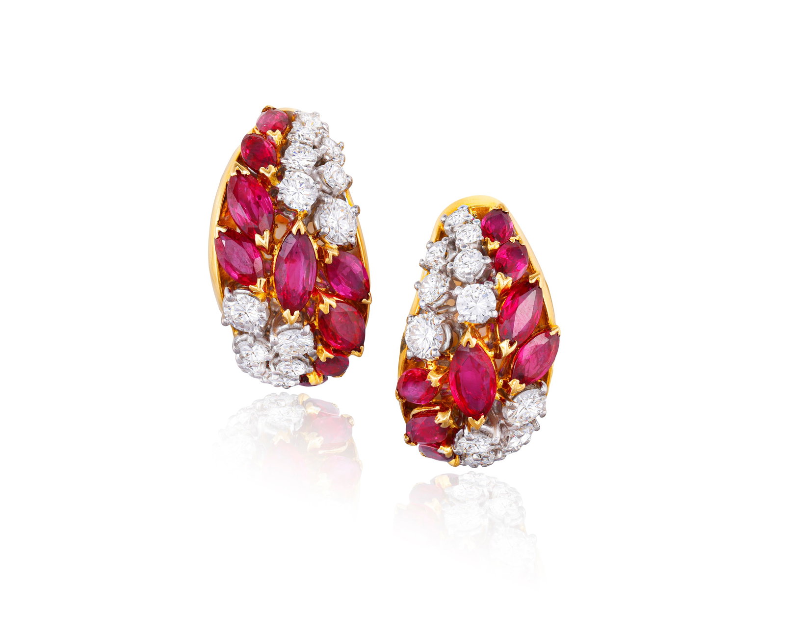 A PAIR OF RUBY AND DIAMOND EARCLIPS Of bombé design, each set with a series of marquise-shaped (1 of 2)