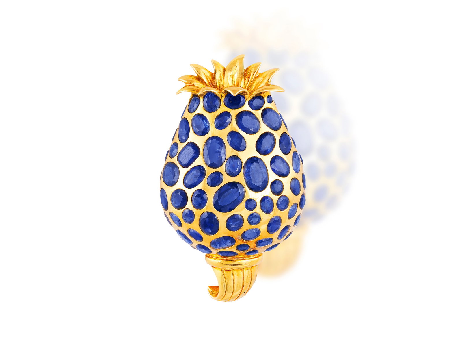 HERZ-BELPERRON, SOCIÉTÉ NOUVELLE: A SAPPHIRE BROOCH Designed as a stylised tulip bud, the: HERZ-BELPERRON, SOCIÉTÉ NOUVELLE: A SAPPHIRE BROOCH Designed as a stylised tulip bud, the tapering body set with oval and circular-cut sapphires throughout, below a crown of curling polished
