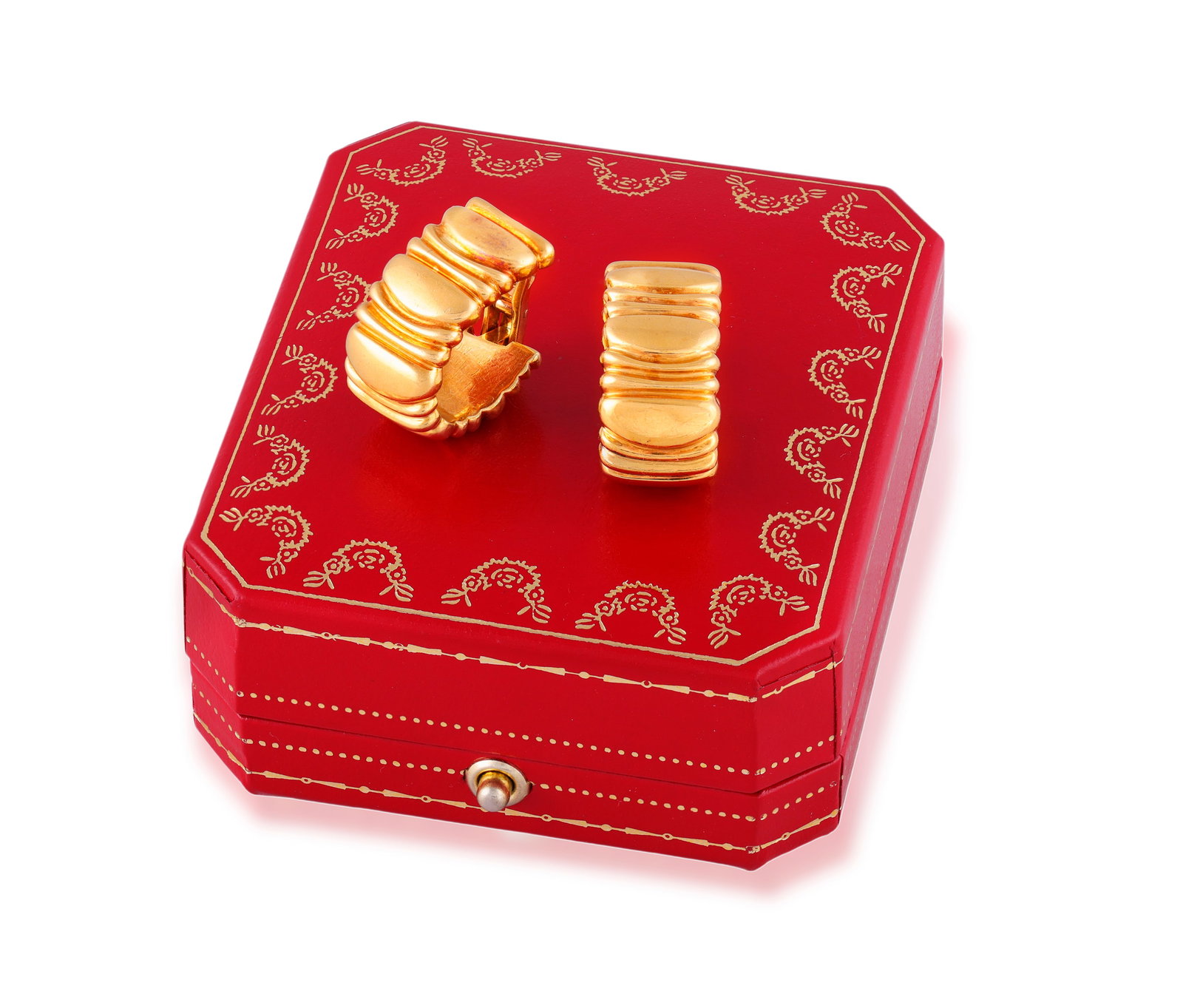 CARTIER: A PAIR OF GOLD EARCLIPS Of hoop design, each front with tapering bombé-ribbed form: CARTIER: A PAIR OF GOLD EARCLIPS Of hoop design, each front with tapering bombé-ribbed form with a series of graduated polished gold sections, in 18K gold, signed Cartier, numbered, French assay 
