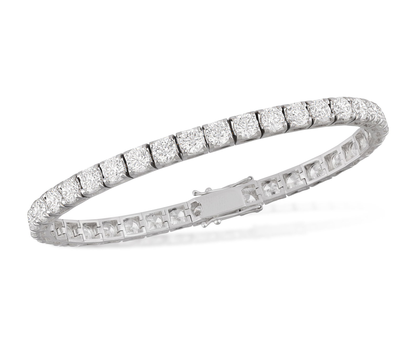 A DIAMOND LINE BRACELET Composed of a continuous row of brilliant-cut diamonds weighing (1 of 4)