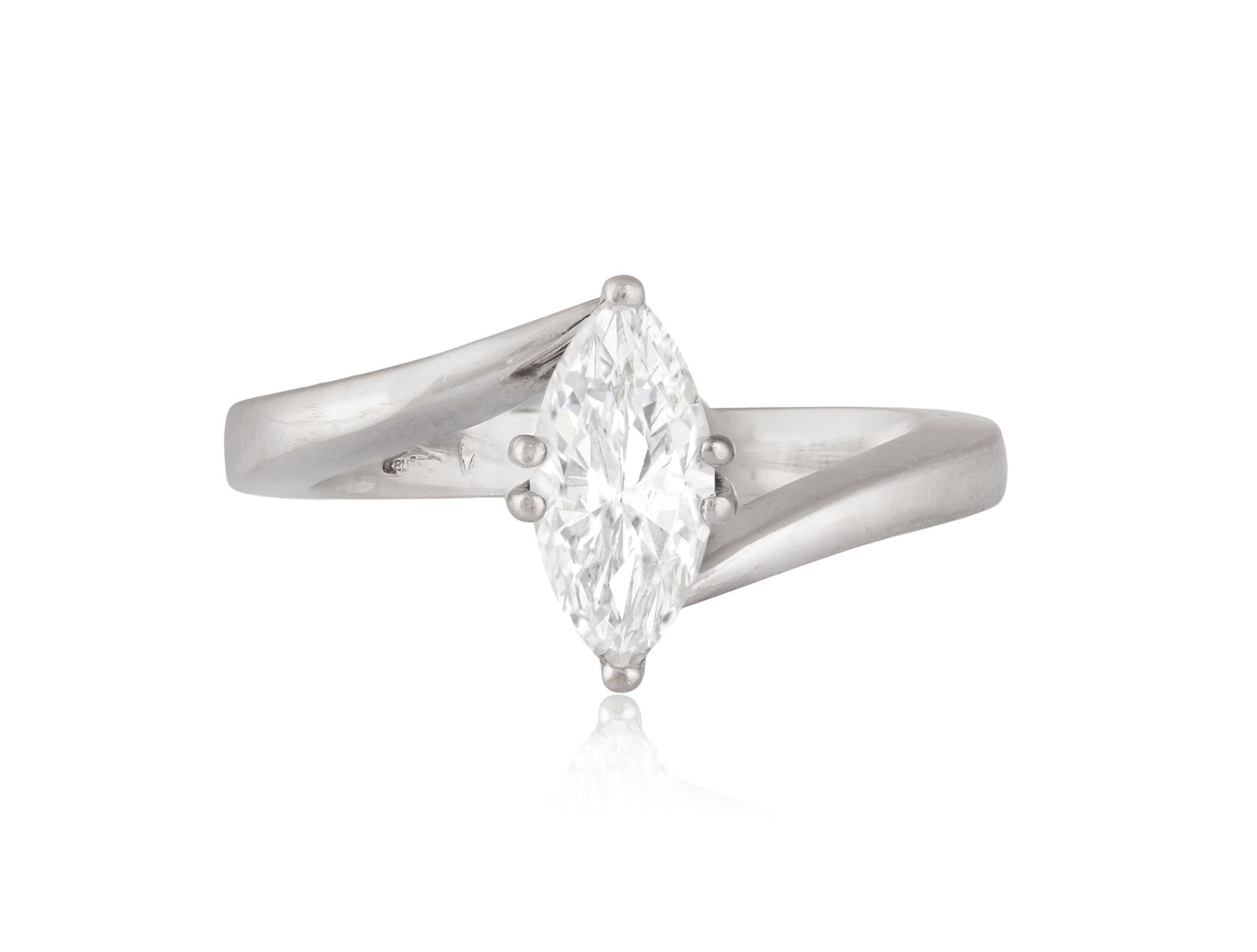 A DIAMOND SINGLE-STONE RING The marquise-shaped diamond within a six-claw setting, to tapered: A DIAMOND SINGLE-STONE RING The marquise-shaped diamond within a six-claw setting, to tapered baguette-cut diamond shoulders, mounted in 18K gold, ring size K Accompanied by a report from the HRD labo
