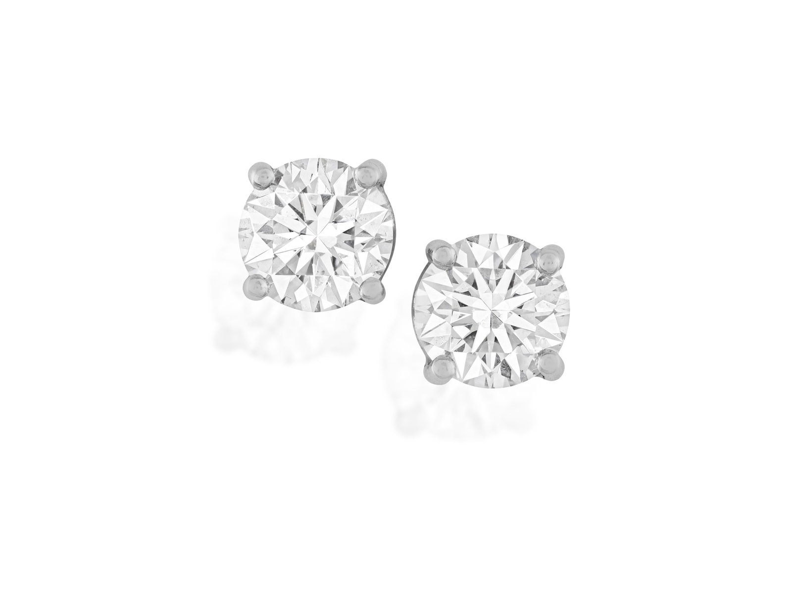 A PAIR OF DIAMOND EARSTUDS Each brilliant-cut diamond weighing 0.50ct, set within a four-claw (1 of 2)