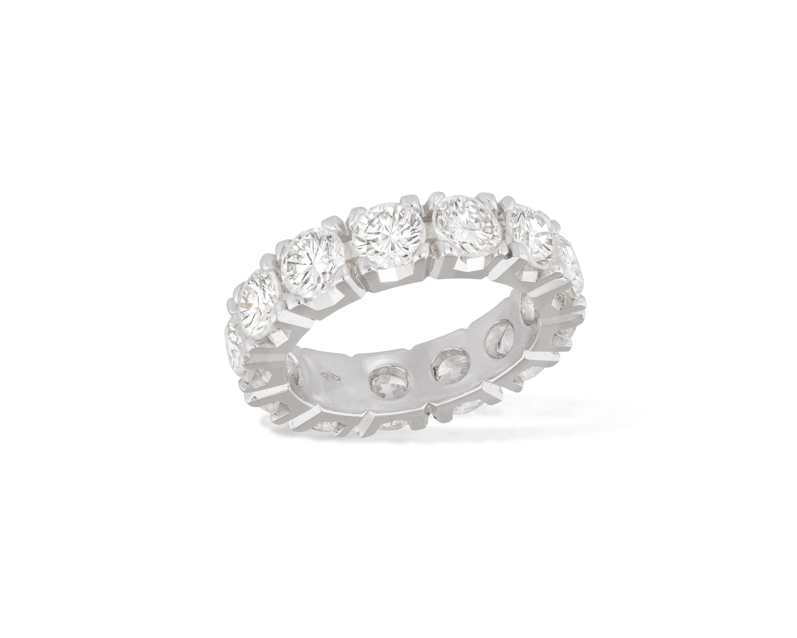 A DIAMOND ETERNITY RING Composed of a continuous row of thirteen brilliant-cut diamonds within: A DIAMOND ETERNITY RING Composed of a continuous row of thirteen brilliant-cut diamonds within claw-setting, mounted in 18K gold, diamonds approximately 6.60cts total, ring size O⅓