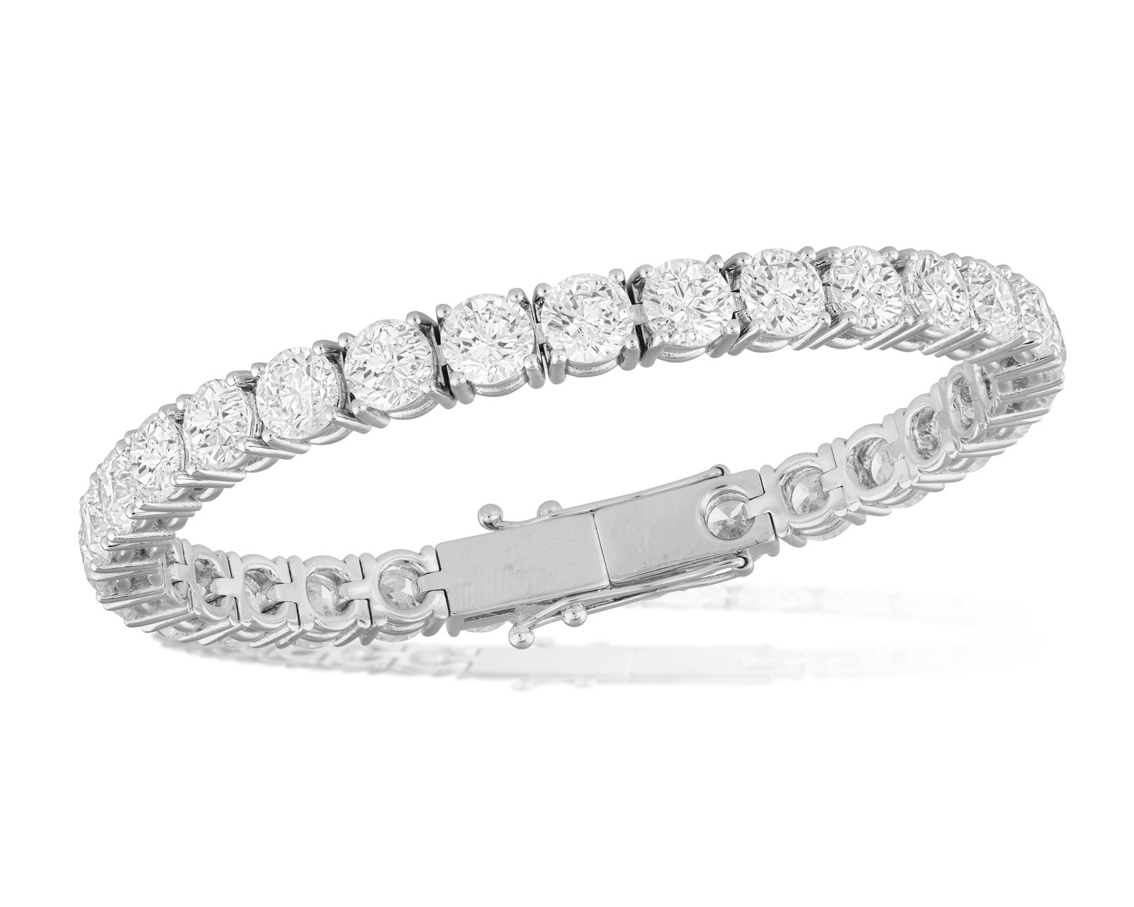AN IMPORTANT DIAMOND LINE BRACELET Composed of a continuous line of thirty brilliant-cut diamonds (1 of 4)