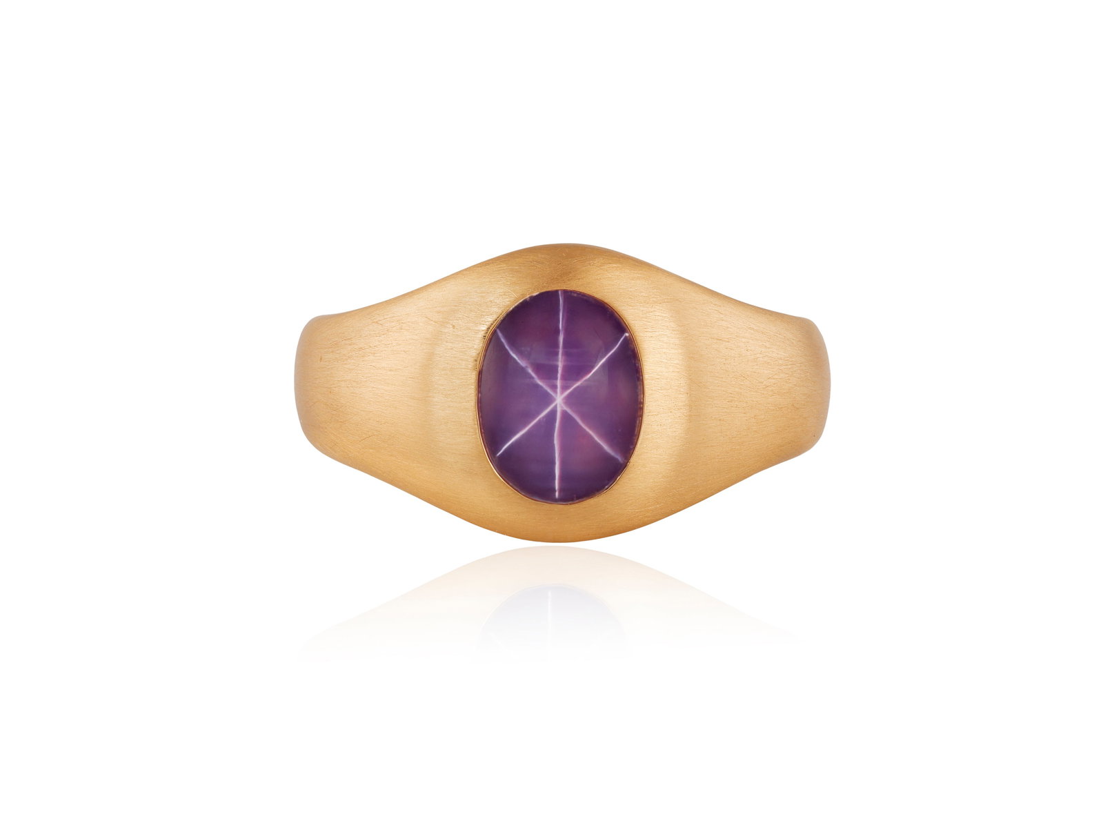 A STAR RUBY RING The collet-set oval-shaped star ruby cabochon weighing approximately 2.70cts,: A STAR RUBY RING The collet-set oval-shaped star ruby cabochon weighing approximately 2.70cts, within a bombé brushed 18K rose gold mount, with maker's mark, French assay mark, ring size R