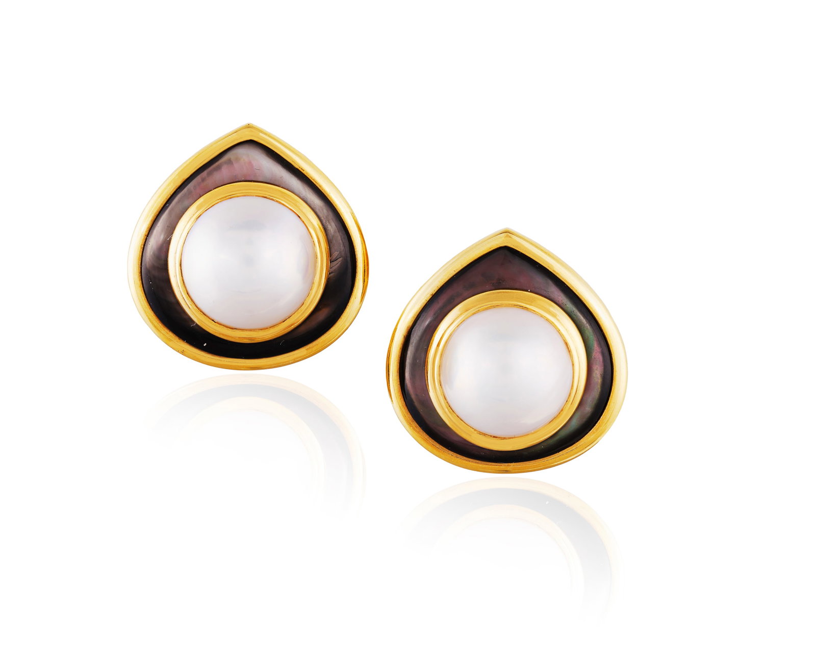 MARINA B: A PAIR OF CULTURED PEARL AND MOTHER-OF-PEARL 'MEDIEVAL' EARCLIPS, CIRCA 1980 Each: MARINA B: A PAIR OF CULTURED PEARL AND MOTHER-OF-PEARL 'MEDIEVAL' EARCLIPS, CIRCA 1980 Each designed as a stylised teardrop, the button-shaped cultured pearl within a mother-of-pearl surround and yell