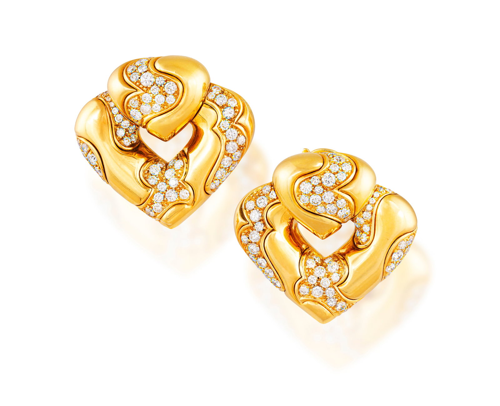 MARINA B: A PAIR OF DIAMOND 'PARDY PAVÉ' EARCLIPS, CIRCA 1980 Each designed as a stylised (1 of 3)