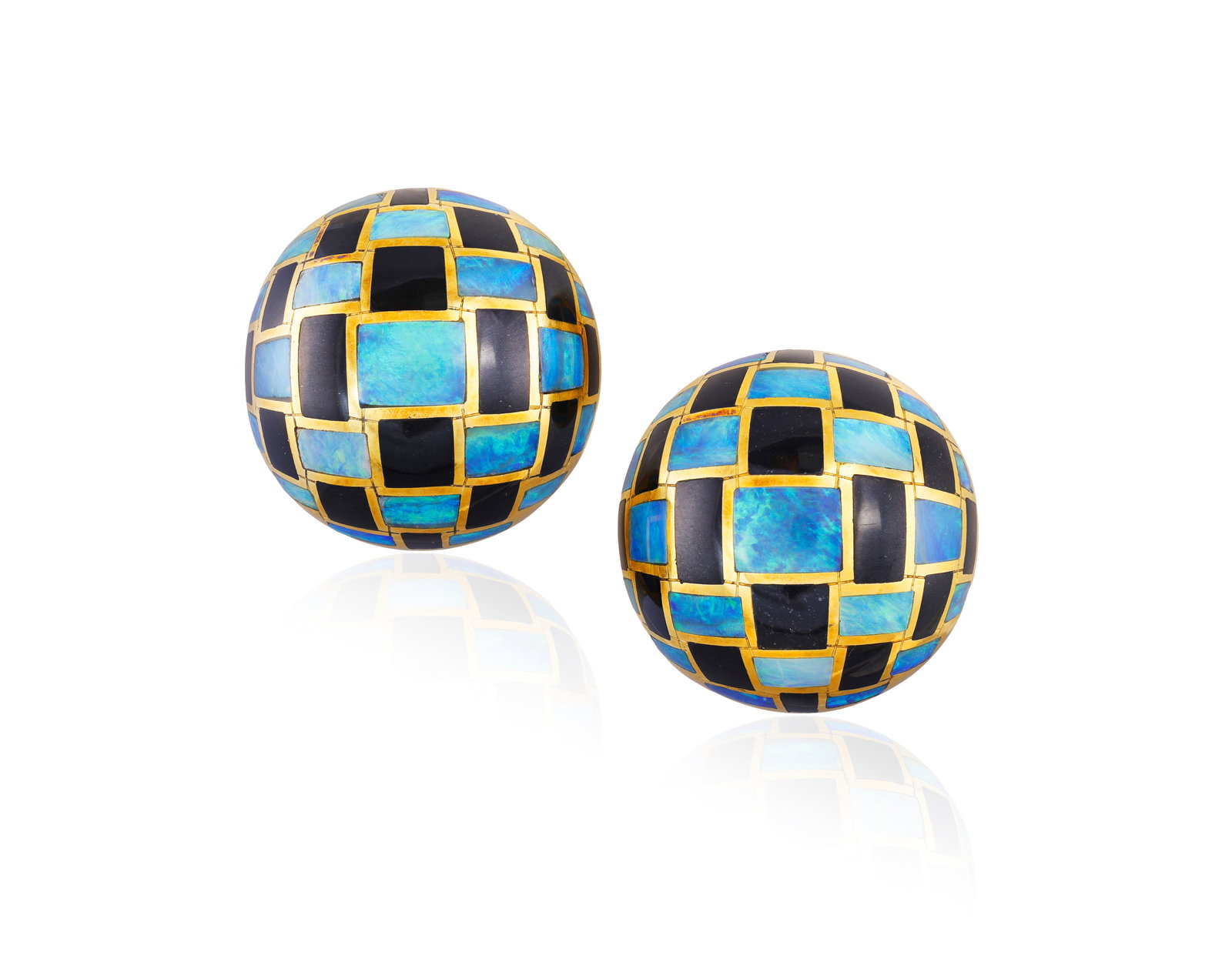 TIFFANY & CO. DESIGNED BY ANGELA CUMMINGS: A PAIR OF OPAL AND BLACK JADE EARCLIPS, CIRCA 1980 Of: TIFFANY & CO. DESIGNED BY ANGELA CUMMINGS: A PAIR OF OPAL AND BLACK JADE EARCLIPS, CIRCA 1980 Of circular bombé chequerboard design, inlaid with opal and black jade within polished gold frames, m