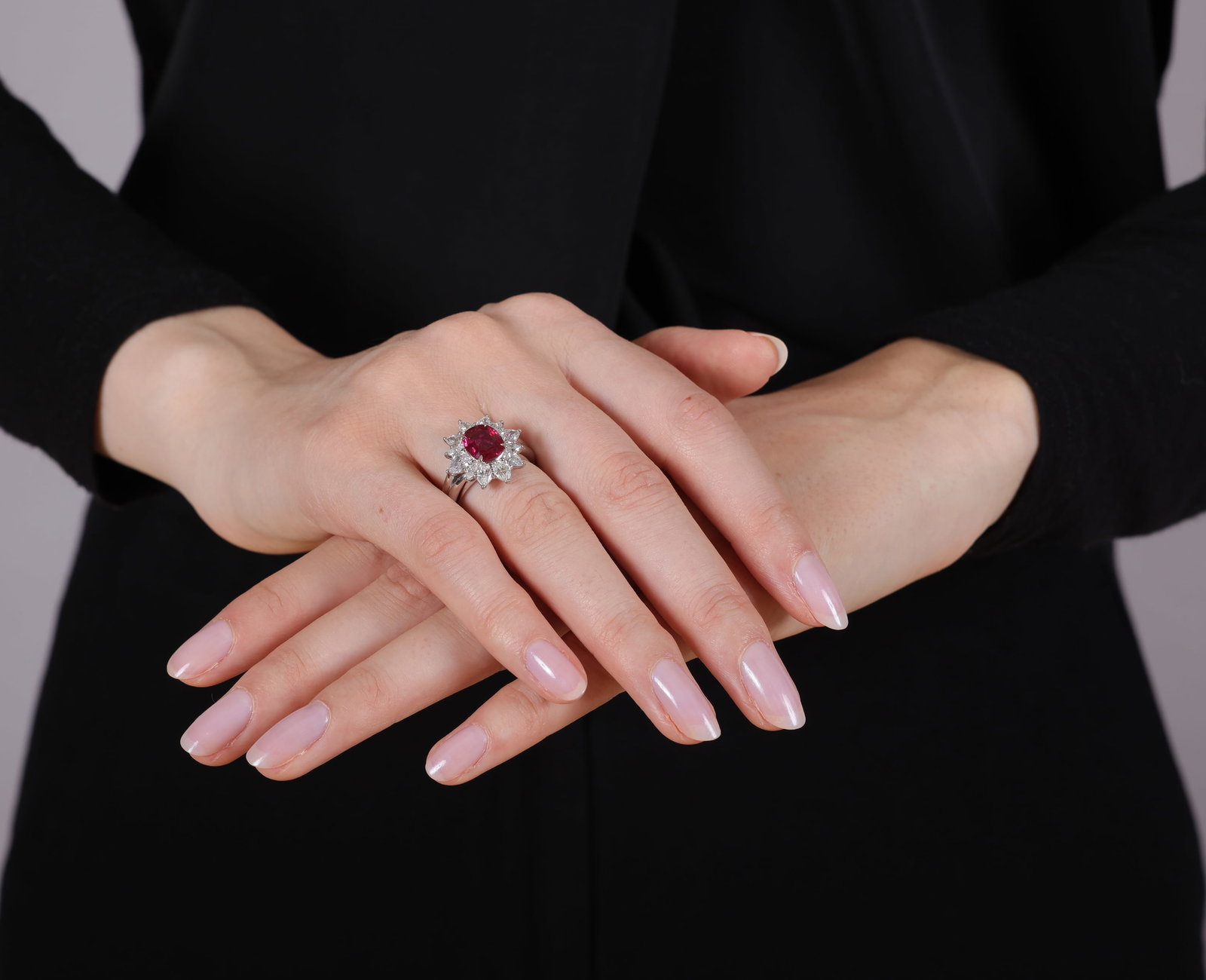 A RUBY AND DIAMOND CLUSTER RING Centring a cushion-shaped ruby weighing approximately 2.10cts, - 6