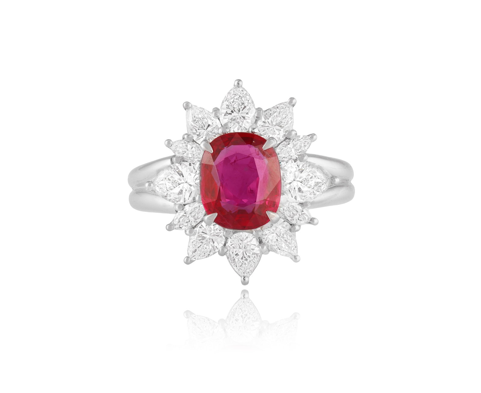 A RUBY AND DIAMOND CLUSTER RING Centring a cushion-shaped ruby weighing approximately 2.10cts, (1 of 6)