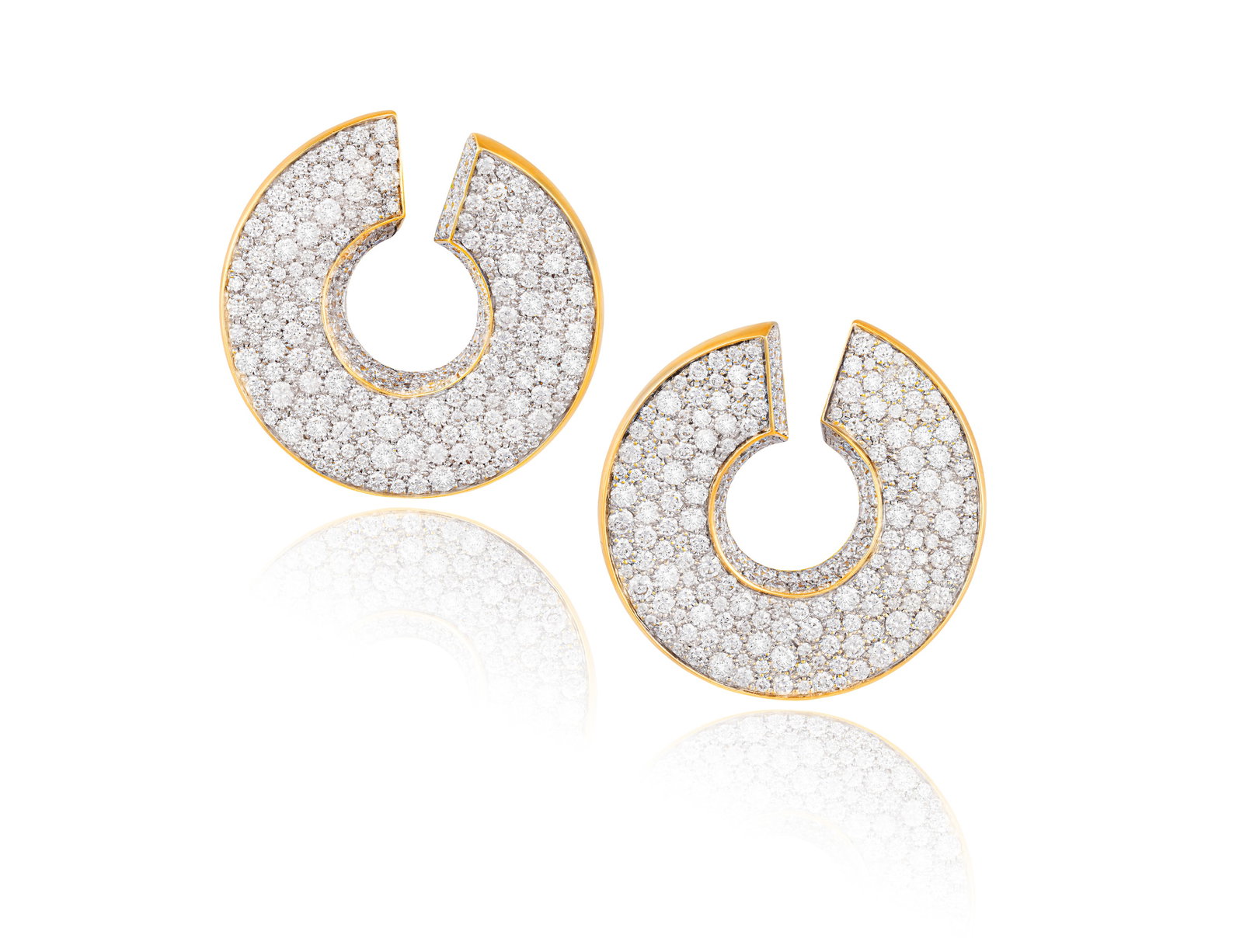 A PAIR OF DIAMOND EARRINGS Each designed as a pierced spiral, pavé-set with brilliant-cut: A PAIR OF DIAMOND EARRINGS Each designed as a pierced spiral, pavé-set with brilliant-cut diamonds throughout, mounted in 18K gold, diamonds approximately 11.00cts total, French import mark, length 3