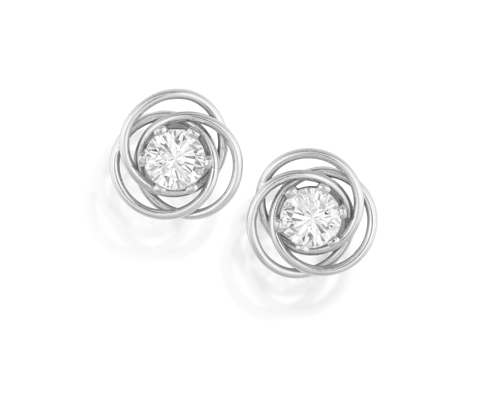 A PAIR OF DIAMOND EARRINGS Each designed as an infinity-knot cluster, of interlaced polished gold: A PAIR OF DIAMOND EARRINGS Each designed as an infinity-knot cluster, of interlaced polished gold wire loops, centring a six-claw brilliant-cut diamond, mounted in 18K gold, diamonds weighing approxim