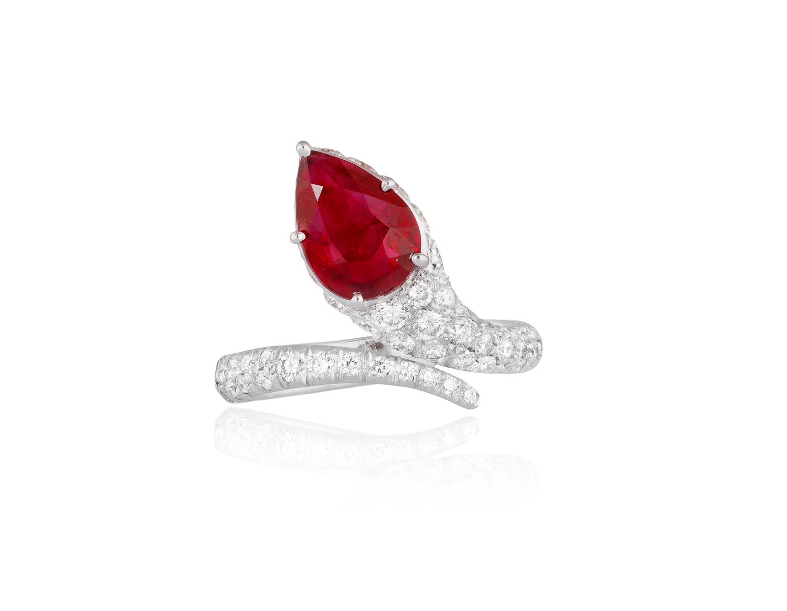 VILLA: A RUBY AND DIAMOND DRESS RING Of snake design, set with a pear-shaped ruby weighing (1 of 5)