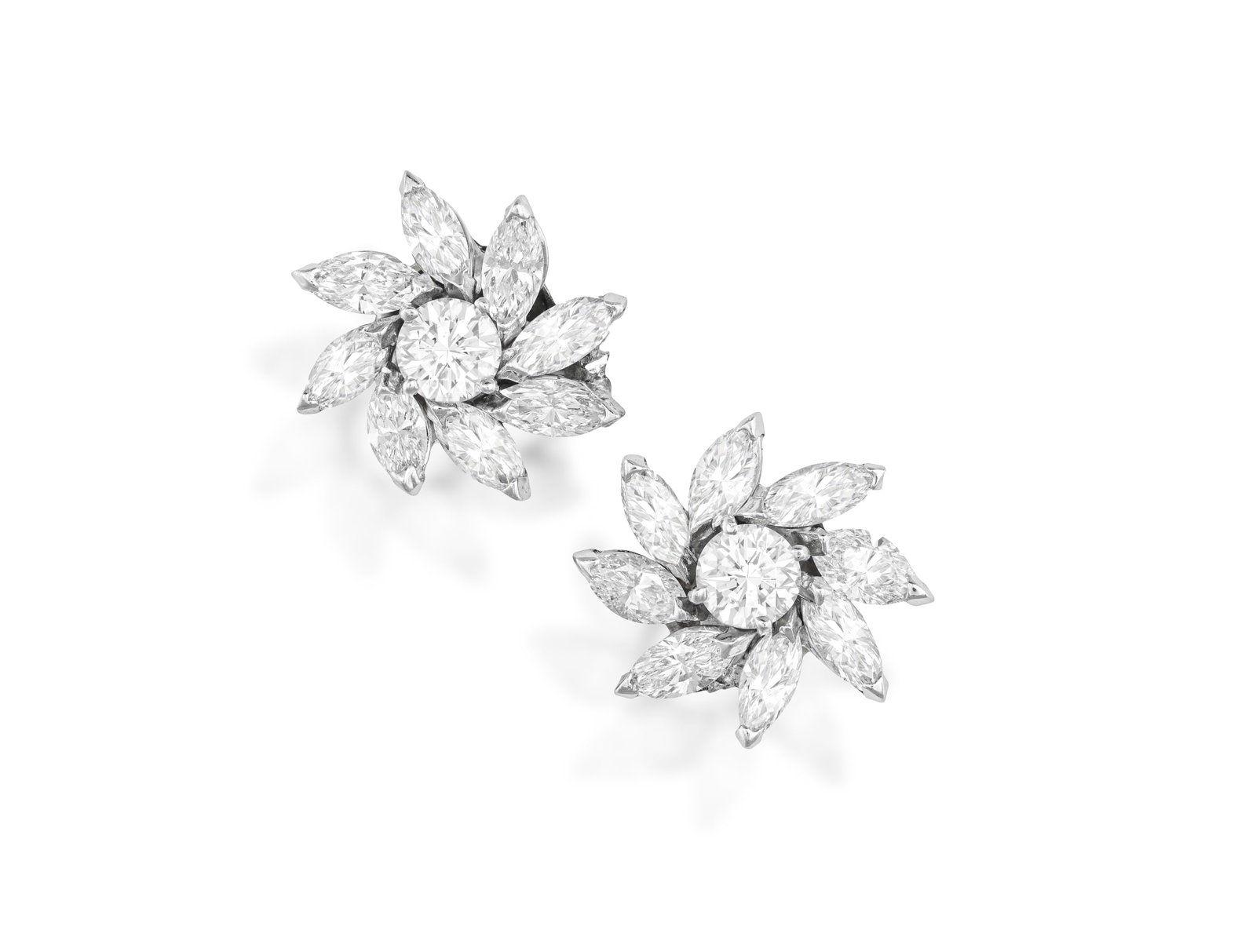A PAIR OF DIAMOND CLUSTER EARRINGS Each brilliant-cut diamond at the centre, within a surround of (1 of 3)