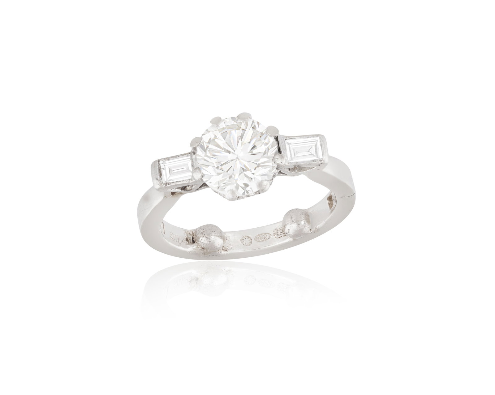 A DIAMOND SINGLE-STONE RING The transitional-cut diamond weighing approximately 1.40cts, within an: A DIAMOND SINGLE-STONE RING The transitional-cut diamond weighing approximately 1.40cts, within an eight-claw setting and between baguette-cut diamond shoulders, mounted in 18K gold, with maker's mark