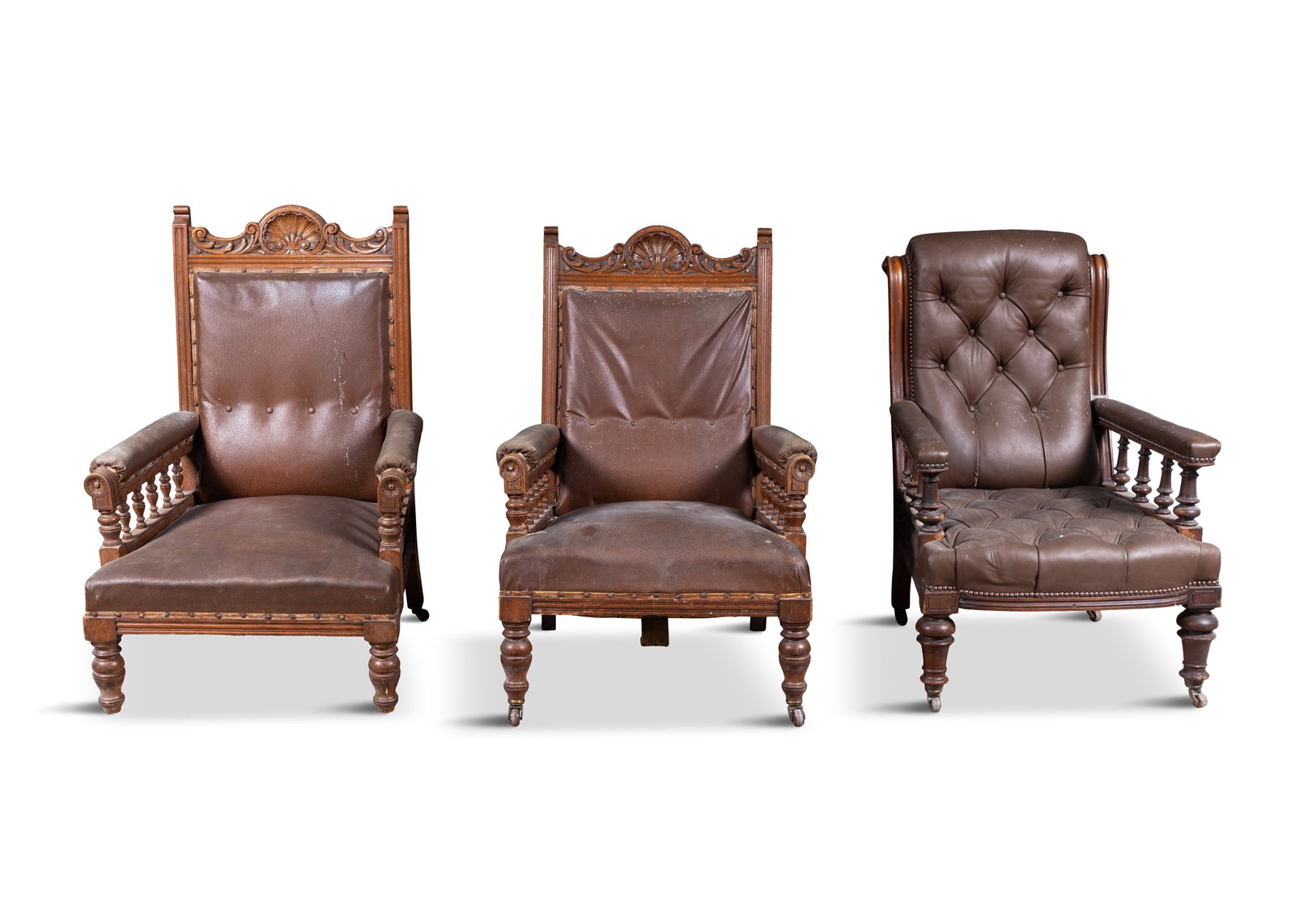 A SET OF NINE OAK FRAMED AND LEATHER UPHOLSTERED CHAIRS, 19TH CENTURY comprising three armchairs: A SET OF NINE OAK FRAMED AND LEATHER UPHOLSTERED CHAIRS, 19TH CENTURY comprising three armchairs and six singles chairs
