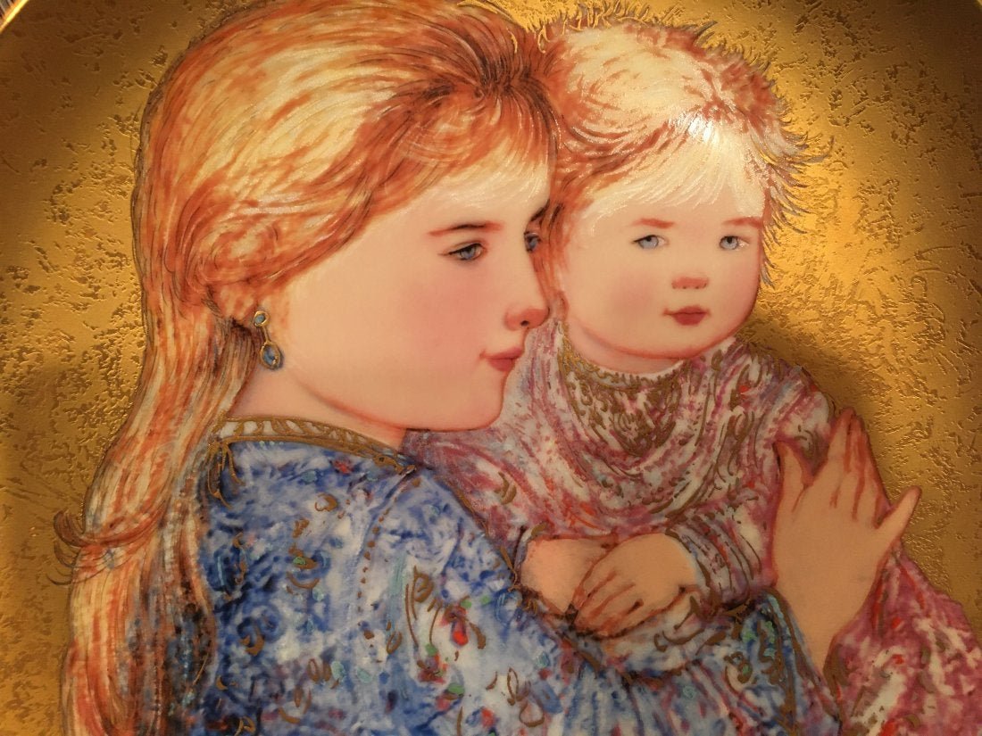 Edna Hibel plate titled Golden Child: Edna Hibel plate titled Golden Child measuring 9" 5/8 inches.