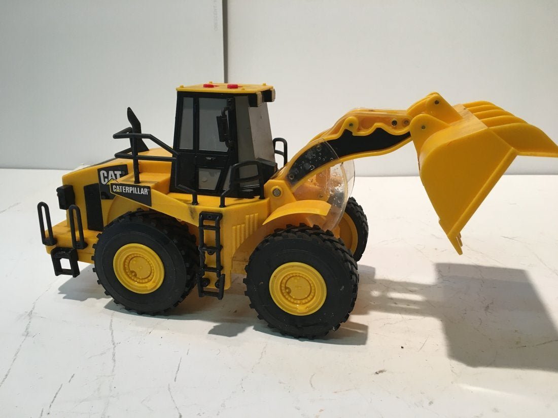A Caterpillar Wheel Loader TOY: A Caterpillar Wheel Loader plastic TOY.
