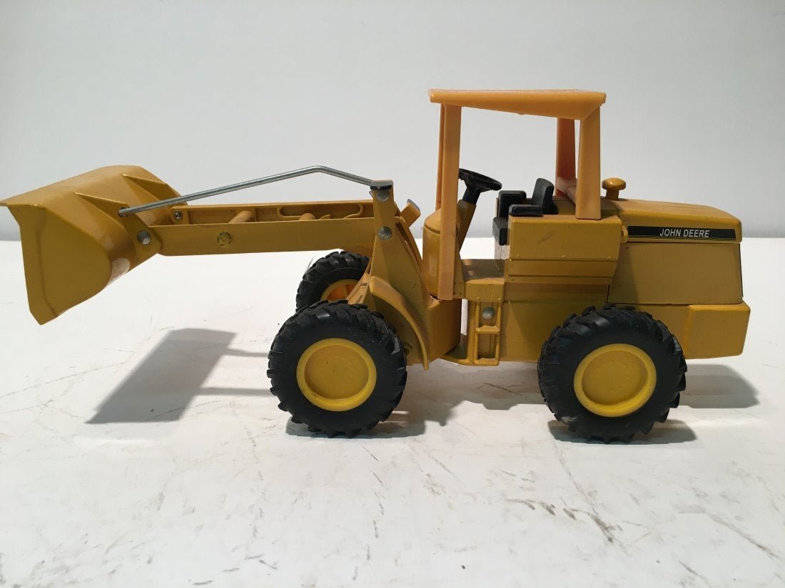 A Norscot Caterpillar 988g Wheel Loader Model Toy