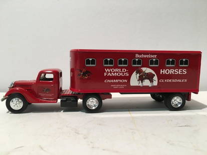 ERTL 1941 Ford Truck Budweiser metal Toy Model: A limited edition ERTL 1941 Ford Truck and a trailer coin bank metal model TOY. The trailer and the truck bear The Budweiser logo and has a coin drop slot.