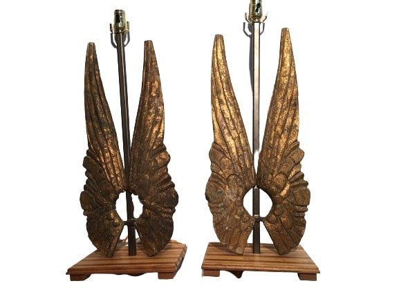 Set of Carved Italian Giltwood Angel wings lamps: A set of antique hand Carved Italian Giltwood Angel Wings converted into Lamps. Each set of wings mounted on a custom metal rod set on a wooden base as table lamps. The height of each lamp from the ba
