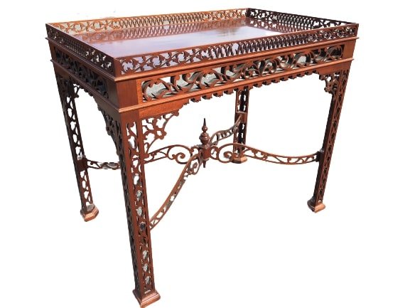Chinese Chippendale Style Mahogany Tea Table: Chinese Chippendale Style Mahogany Tea Table.Rectangular top with reticulated railing around the top and legs. 28" x 21" x 33" inches. All your questions or concerns must be asked prior to the auction
