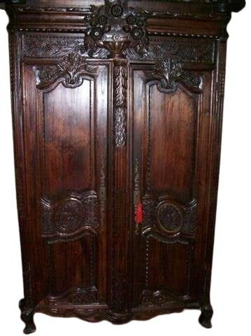 A large armour French carved Cabinet: A large French style Armour carved Cabinet with an adjustable shelf. would hold a 42" inch TV set. Detailed carvings on the doors and the top of the Cabinet.Measures: 84" inches tall x 56" inches wide