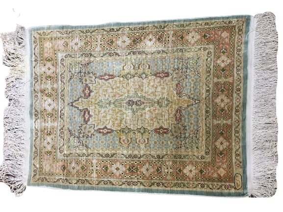 Turkish SILK Hereke small sampler rug: A Pure Silk Turkish Signed HEREKE sampler rug.Measuring 18" inches wide by 23" inches long. Signed on the upper right hereke.